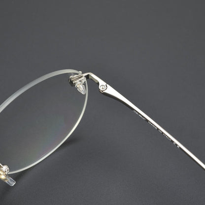 Business Rimless Round Titanium Alloy Glasses with Panther Head Detail – CT0028O - HP eyeglasses